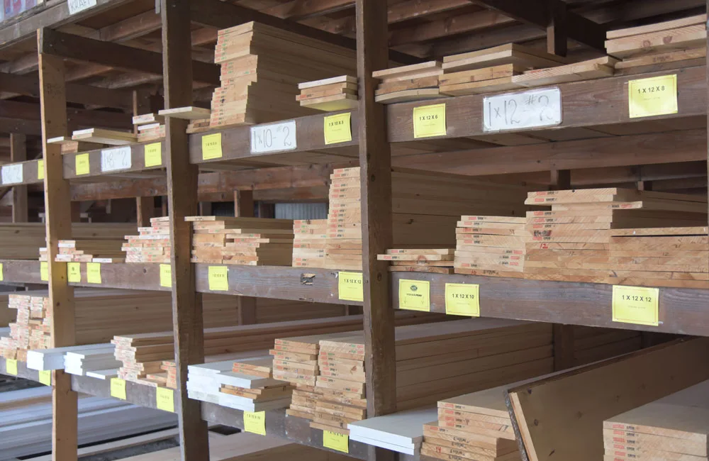 Photo of wood beams on shelves.