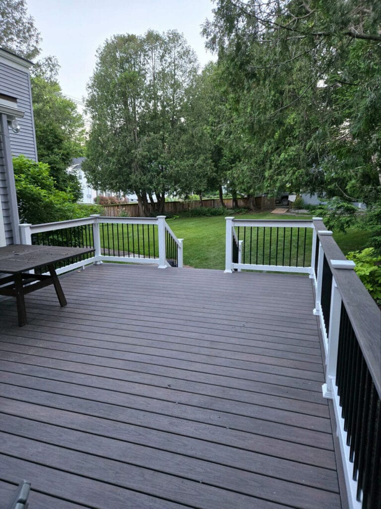 Spacious cedar wood deck built with premium lumber, featuring natural grain and a scenic backyard view – installed using materials from Lincoln Davies Building Supply.